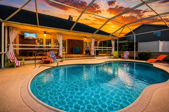 Screened private pool oasis with sunset views and a resort-style patio