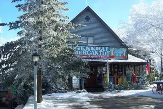 "Immerse yourself in the charm of yesteryears at Fred's Mercantile Barn, a beloved Beech Mountain landmark. As you approach, the sight of its weathered barn exterior beckons, promising a step back in time.