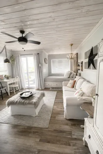 Airy coastal living room with daybed, dining nook & balcony access