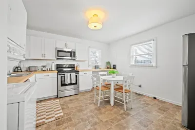 Bright eat-in kitchen with stainless appliances & essentials