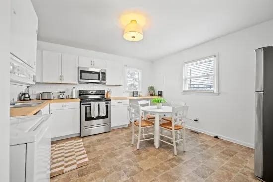 Bright eat-in kitchen with stainless appliances & essentials