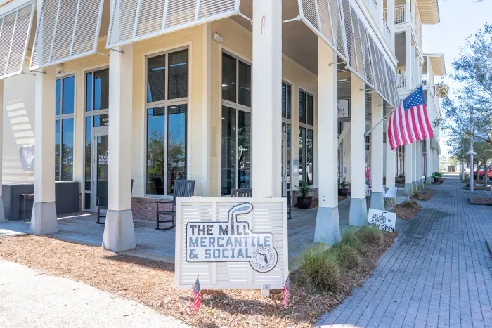 Fun bar with corn hole and live music located short golf cart ride away from Port Escape.