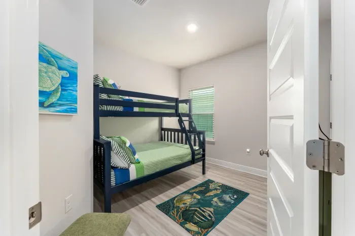 Bunk room with full bed on bottom and twin bed on top.