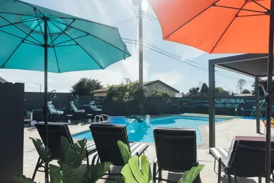 Pool area with a comfortable reclining chair, perfect for lounging, sunbathing, and relaxing in total comfort by the water.
