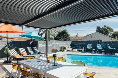 Outdoor dining area beside the pool, perfect for relaxing meals, casual hangouts, and enjoying the fresh air in a peaceful setting.