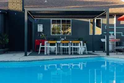A cozy and inviting pool area, perfect for unwinding and enjoying a refreshing dip in a relaxed outdoor setting.