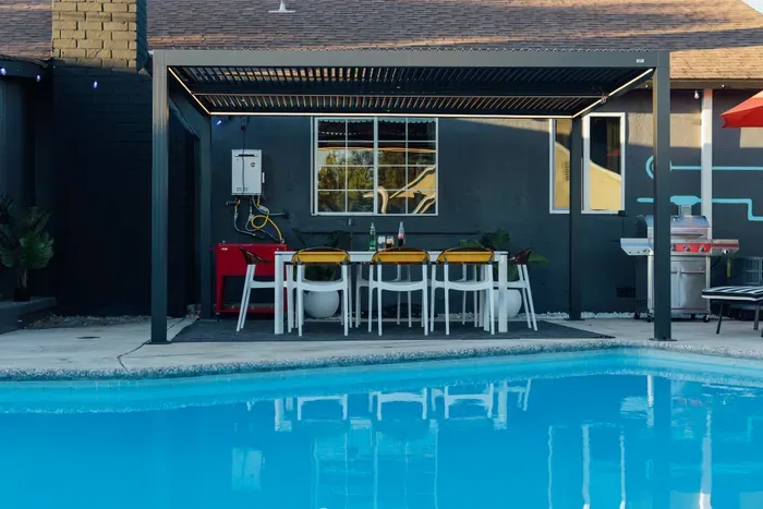 A cozy and inviting pool area, perfect for unwinding and enjoying a refreshing dip in a relaxed outdoor setting.