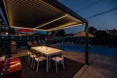 Spacious backyard with a relaxing open-air setting, perfect for lounging, gathering, or enjoying the outdoors in a peaceful atmosphere.