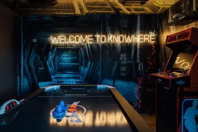 Fun-filled game room designed for entertainment and relaxation, perfect for guests of all ages to enjoy indoor activities and bonding time.