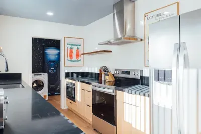 Stylish and fully equipped kitchen designed for convenience, perfect for cooking and gathering during your stay.