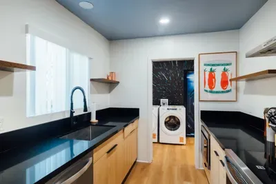 Modern kitchen with everything you need to prepare meals and dine comfortably during your stay.
