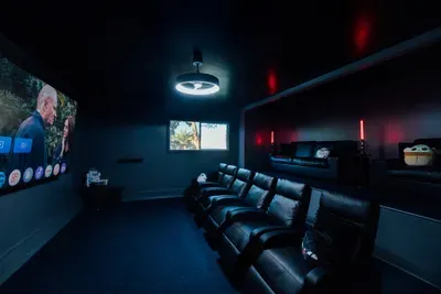 Private cinema-style movie theater offering an immersive entertainment experience with a cozy, relaxing atmosphere.
