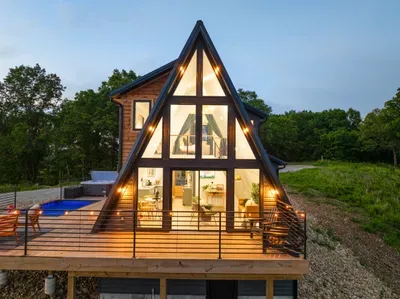 Skyline A-Frame—where modern design meets peaceful lake views.