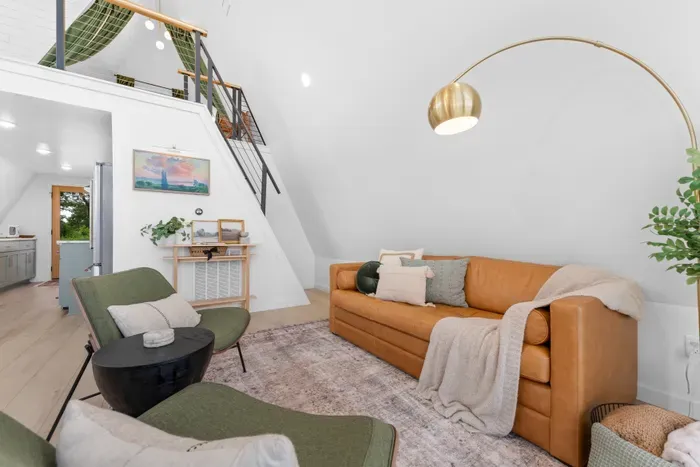 Living Room: Stylish space with warm textures, artistic decor, and a touch of modern charm!