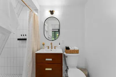 Clean finishes and a minimalist design create a relaxing bathroom experience.