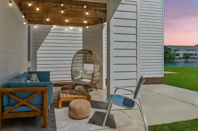 Relax, unwind, and let the good times shine! ✨ Our outdoor lounging patio, draped in cozy bistro lights, is the perfect spot to enjoy warm evenings and cool drinks. A peaceful retreat at Seabreeze Villa, just steps from the beach!