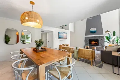 Welcome to Seabreeze Villa! This coastal-inspired entryway sets the tone with natural wood accents, soft lighting, and thoughtful decor—inviting you to unwind and feel right at home. ✨