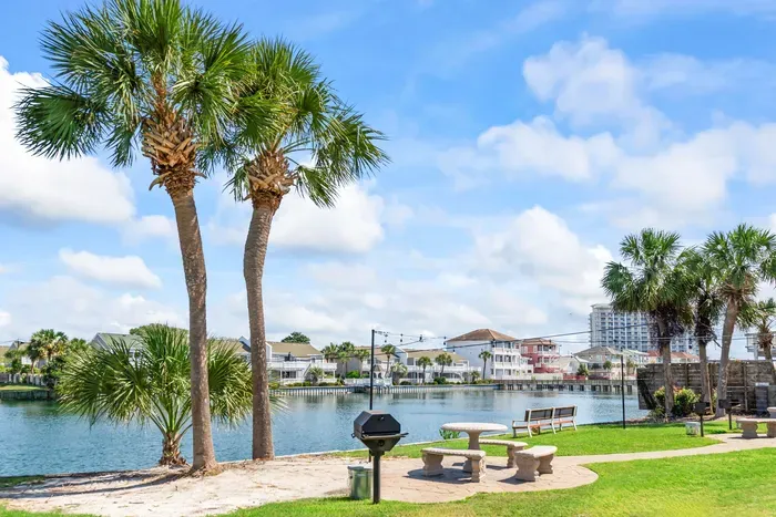 Start your day with calming lake views just beyond the backyard at Seabreeze Villa.