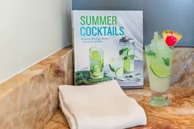 Sip, shake, and stir your way into vacation mode — our summer cocktail book and a fresh mojito are ready to inspire your next happy hour at Seabreeze Villa.