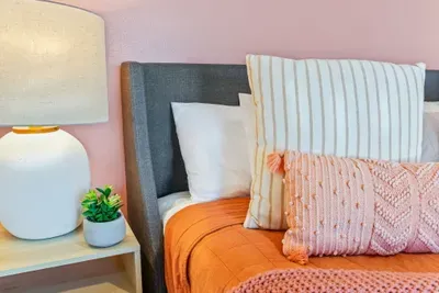 Cozy bed setup with soft pillows for a comfortable stay.