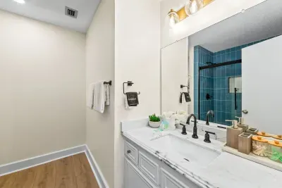 This attached bathroom is perfect for guests staying on the main level—easy, accessible, and equipped with everything you need for a comfortable stay.