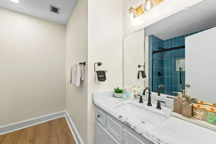 This attached bathroom is perfect for guests staying on the main level—easy, accessible, and equipped with everything you need for a comfortable stay.