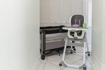 A cozy baby crib and a clean, sturdy high chair are thoughtfully provided to keep your little one comfortable and make family stays easy and enjoyable.