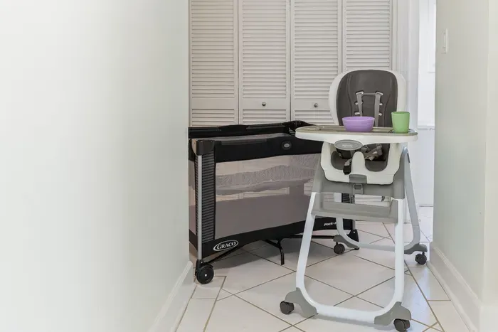 A cozy baby crib and a clean, sturdy high chair are thoughtfully provided to keep your little one comfortable and make family stays easy and enjoyable.