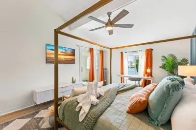 Relax in this beautifully styled bedroom, where coastal charm and cozy details create a peaceful escape.