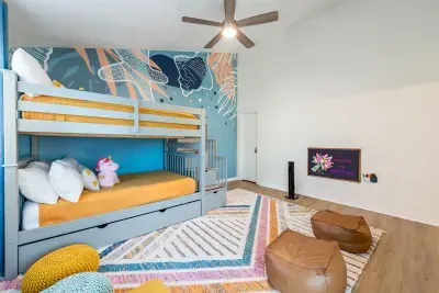 Comfortable kids’ bunk room providing a convenient sleeping space for families.