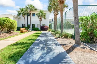 Enjoy a short stroll along this path leading to the tennis court.