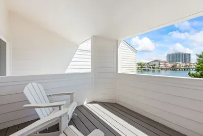 Unwind on your private balcony with cozy Adirondack chairs and peaceful lake views—just steps from the Gulf. Whether it’s morning coffee or a sunset wind-down, this serene spot is made for moments that matter. ☀️