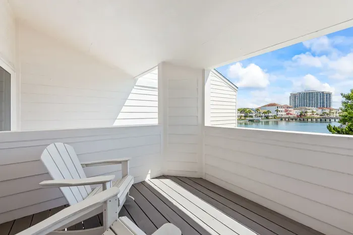 Unwind on your private balcony with cozy Adirondack chairs and peaceful lake views—just steps from the Gulf. Whether it’s morning coffee or a sunset wind-down, this serene spot is made for moments that matter. ☀️