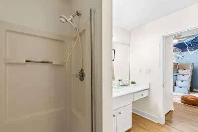 This main-level attached bathroom is perfectly positioned for quick post-beach refreshes, ensuring every guest enjoys a seamless and comfortable stay.