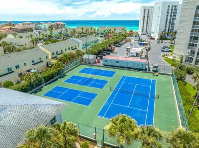 Game, set, match! Enjoy unlimited access to these pristine tennis courts, just steps from your doorstep at Seabreeze Villa. A perfect spot to serve up some fun during your stay!