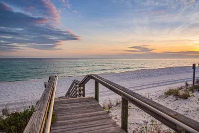 Chase the sunset down this scenic wooden path to the beach ✨ Feel the sand between your toes as you soak in breathtaking views of the sunset.