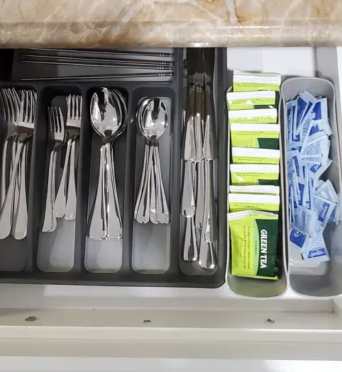 Our neatly organized drawer of silverware has everything you need—from morning coffee spoons to dinner forks—making mealtime a breeze.