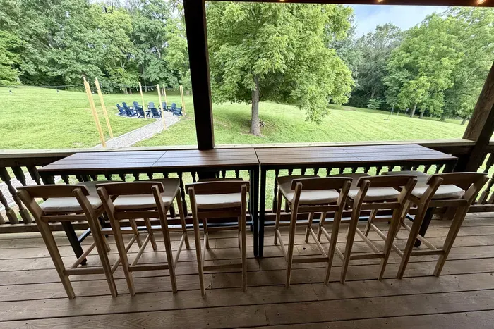 Enjoy coffee, meals, and nature on the back deck with bar seating for six.