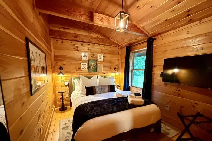 Comfortable second-floor queen room with a Roku TV.
