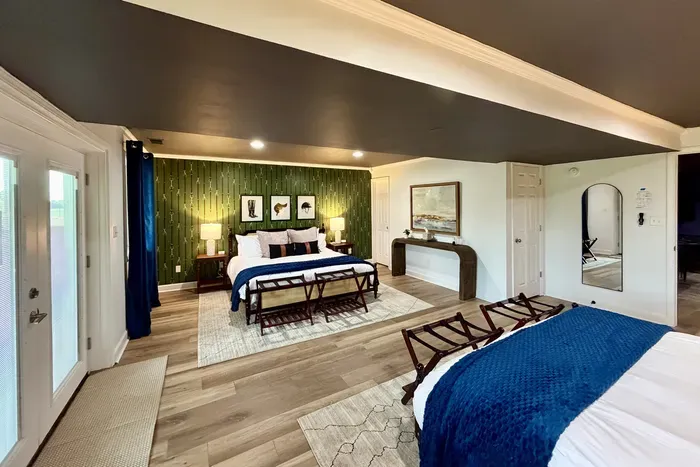Spacious basement bedroom featuring two king beds.