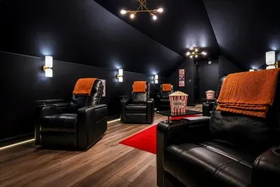 Enjoy movie nights in your private theater with plush reclining seats and convenient tray tables.