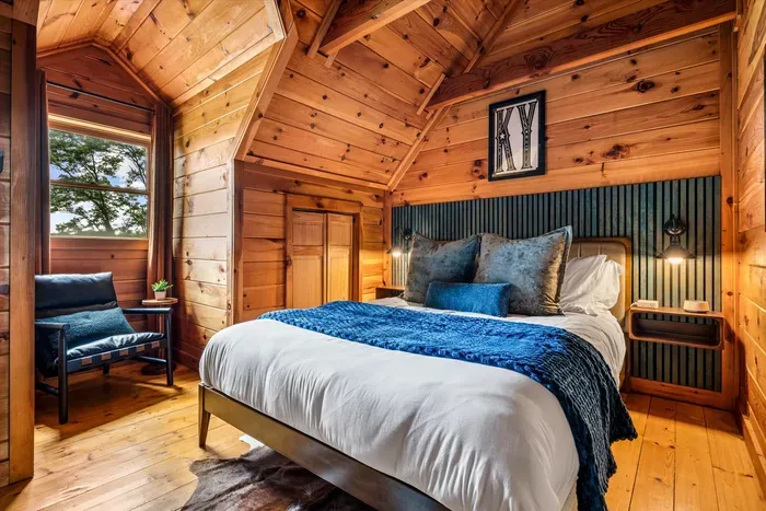 Second-floor queen bedroom with a cozy reading nook.