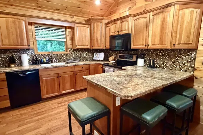 Cook with ease in the fully stocked kitchen and additional seating at the island.