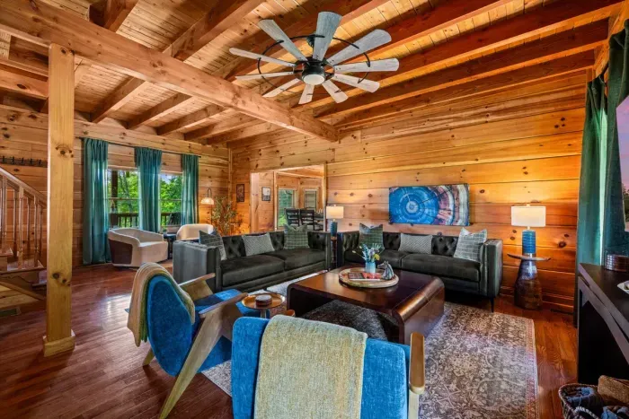 The spacious living room offers plenty of seating for relaxing, reconnecting, and making memories together.
