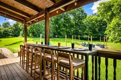 Enjoy coffee, meals, and nature on the back deck with bar seating for six.