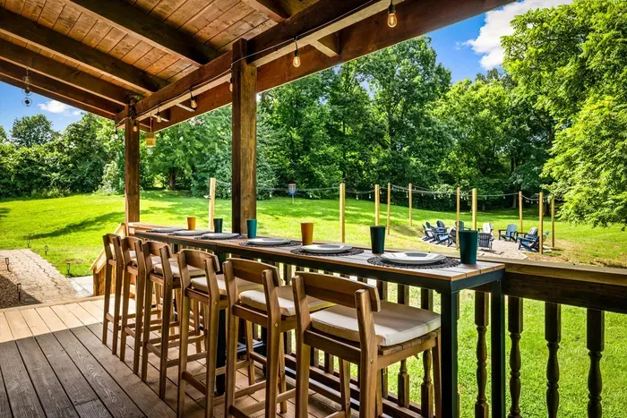 Enjoy coffee, meals, and nature on the back deck with bar seating for six.