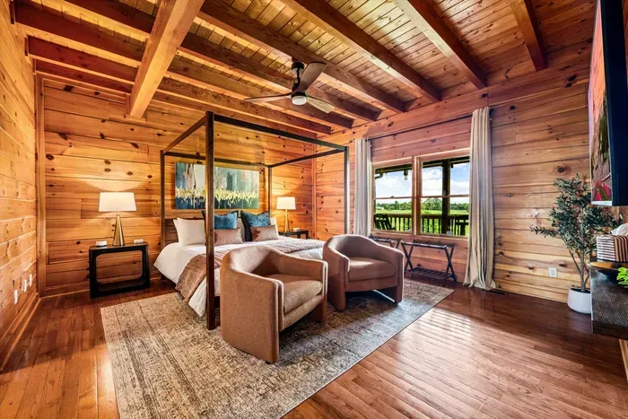 Main-floor primary suite with a king bed and private ensuite bathroom.