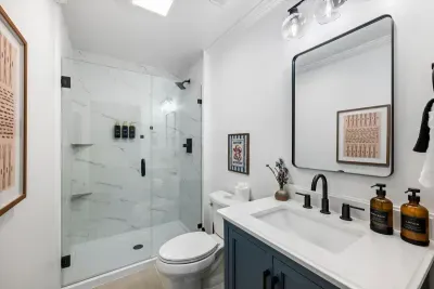 Basement bathroom with a newly renovated walk-in shower.
