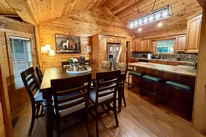 Dine together with seating for 12, including an island and dining table.