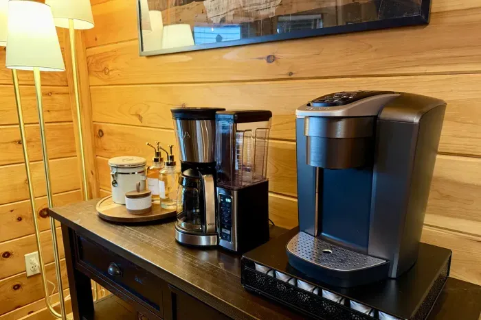 Coffee bar with Ninja drip, Keurig, ground coffee, and pods provided.